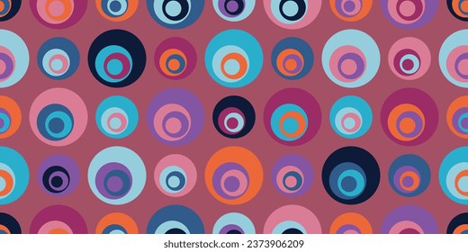 Colored circles with more circles inside them. Vector pattern of circles, with circles inside. Mostly pink colors.