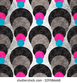 colored circles on a gray background with illumination. Seamless geometric pattern. grunge effect.