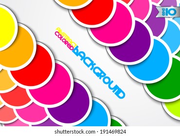 Colored circles of paper on a gray background