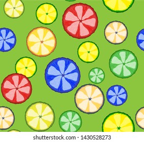 Colored citrus fruit in the cut on lime background