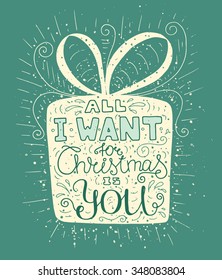 Colored doodle typography poster with gift box. Cartoon cute card on celebration theme with lettering text -All I want for christmas is you. Hand drawn vector illustration isolated on blue background.