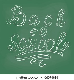 Colored drawing chalk, school supplies, and the inscription back to school