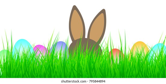 colored easter eggs and easter bunny in lush green grass