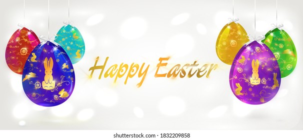 Colored Easter eggs are painted with a gold pattern. Easter horizontal banner with gold lettering on a light background with bokeh effect.