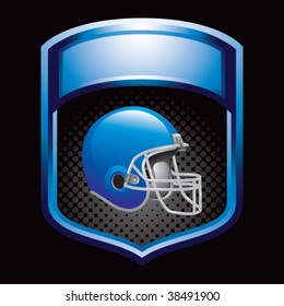 colored football helmet on blue display