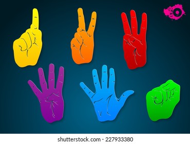 Colored hand gestures from a paper on a blue background