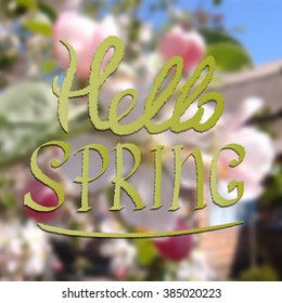 Colored illustration with chalk drawn  text ''hello spring'' on blurred background with blooming tree. Hello spring theme. Card design.