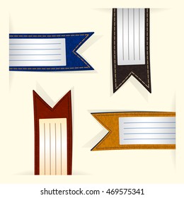 colored leather labels looking out of paper at different angles
