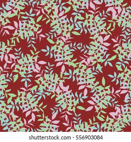 colored leaves on a red background. seamless pattern