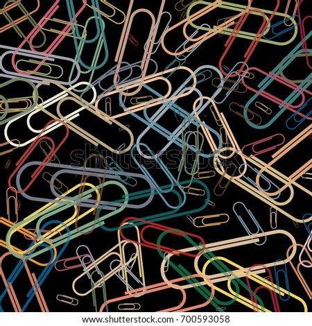 Colorful paper clips on a black board surface