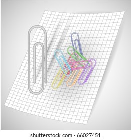 colored paper-clips on square paper