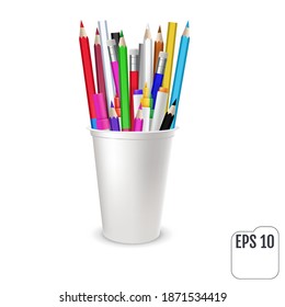 Colored pencils and felt-tip pencils in a glass
