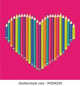 colored pencils forming a heart on pink dots