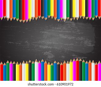 Colored pencils on blackboard background