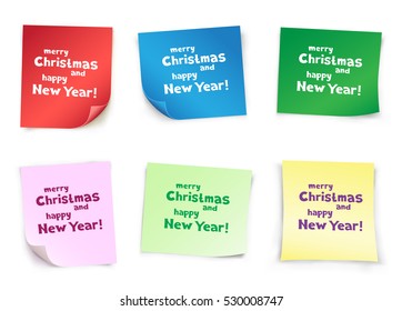 The colored pieces of paper with the message of Christmas greetings on white background