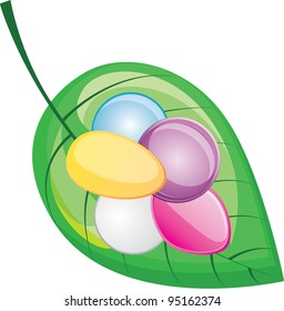 colored pills on a green leaf, vector illustration