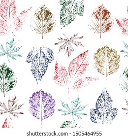 colored prints of different leaves make up a seamless pattern. the effect of living material-colored pencils, watercolors. vector illustration. EPS 10.