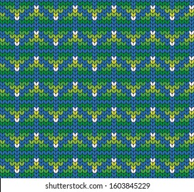 Colored seamless geometric pattern. Imitation of knitted fabric. Jacquard for sweaters, scarves and other clothing. Decorative background.