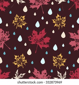 Colored seamless pattern with autumnal leaves and drops.  Ink collection.