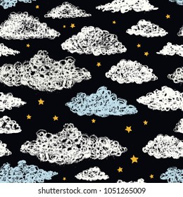 Colored seamless pattern of clouds and stars drawn by chalk on a black board. Drawing with living material.