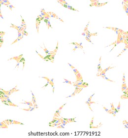 colored silhouettes of swallows abstract feathers. 