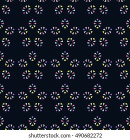 Colored stars on a dark background. Seamless pattern. Vector
