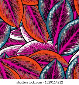 Colored tropical leaves on a pink background. Tropical seamless pattern with exotic leaves.