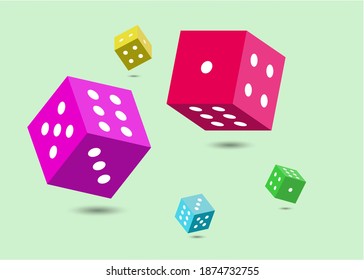 Colorful 3 dimensional dices isolated on green background