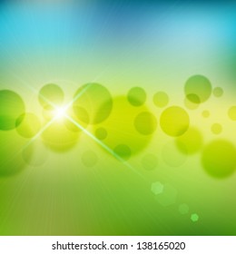 Colorful abstract background with defocused grass and sky and circle of light