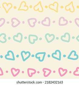 Colorful aligned hearts and dots over beige background