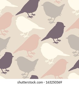 Colorful  background with birds silhouettes. Vector seamless pattern