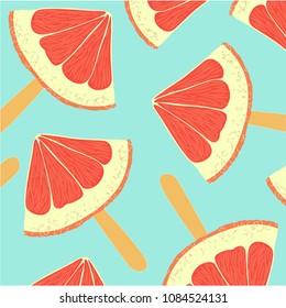 Colorful background with slices of grapefruit on a wand