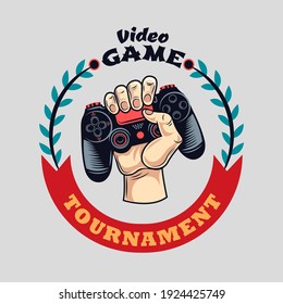 Colorful badge with grasping gamepad vector illustration. Vintage label with joystick in human hand. Cybersport and gaming tournament concept can be used for retro template