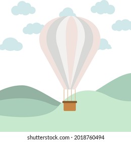 Colorful balloon among blue clouds with pastel colors and green background