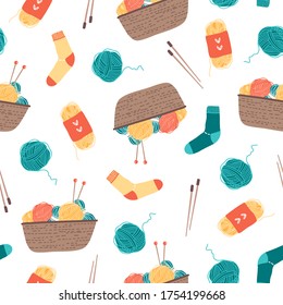 Colorful basket with yarn, knitting needles, socks seamless pattern on white. Flat vector illustration in cartoon style.