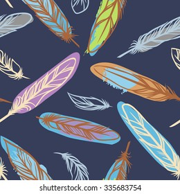 Colorful bird feathers on dark blue background/ Vector seamless pattern.