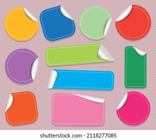Colorful blank labels stickers on different size and shape isolated on striped background