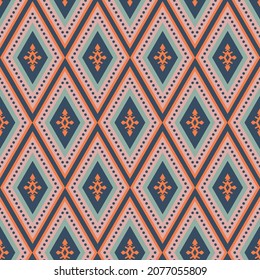 Colorful boho southwest seamless vector pattern. Navy blue, orange, pink and green bohemian style geometric diamond design. Decorative print with western shapes. Repeat background surface texture.