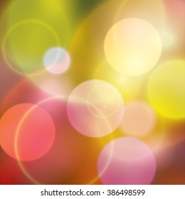 Colorful bokeh multi colored background with warm colors 