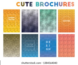 Colorful brochures with geometric patterns and gradient backgrounds.