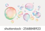 Colorful bubbles floating on a white background. Rainbow bubbles, vibrant and translucent. Bubbles create a playful, dreamy atmosphere. Bubbles in various sizes. Soap bubble element vector set.