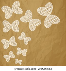 colorful butterflies on a crumpled paper brown background