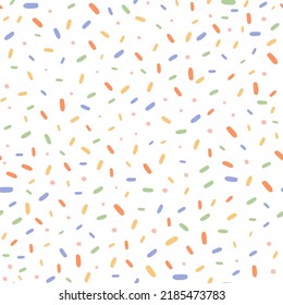 Colorful cake sprinkles seamless pattern with white background.