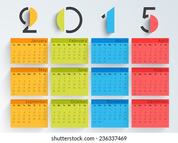 Colorful calendar of 2015 on blue background for Happy New Year celebrations.