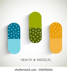 colorful capsules on abstract background.