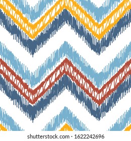 Colorful Chevron Ikat Seamless Pattern. Hand Drawn Doodle Multicolor Stripes. Vector Zig zag Striped Abstract Background