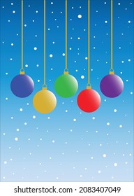 Colorful Christmas balls hanging neatly against the background of a blue sky filled with snowfall.