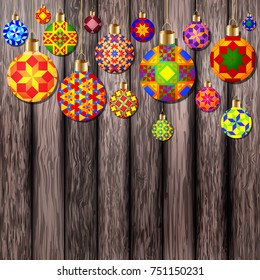 Colorful Christmas balls on wooden background