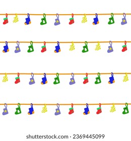 Colorful Christmas stocking hanging on the rope, four strings. Isolated on white background.