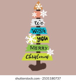 A colorful Christmas tree design made of layered, wooden planks features the message "We Wish You Merry Christmas" with snowflakes. Its playful style evokes holiday cheer.